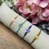 Pulsera cruz acetato bolitas de colores - Imagen 2