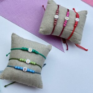 Pack 15 Pulseras cruz resina con abalorios