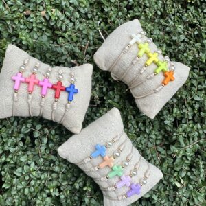 Pack 15 Pulseras cruz y perla de resina